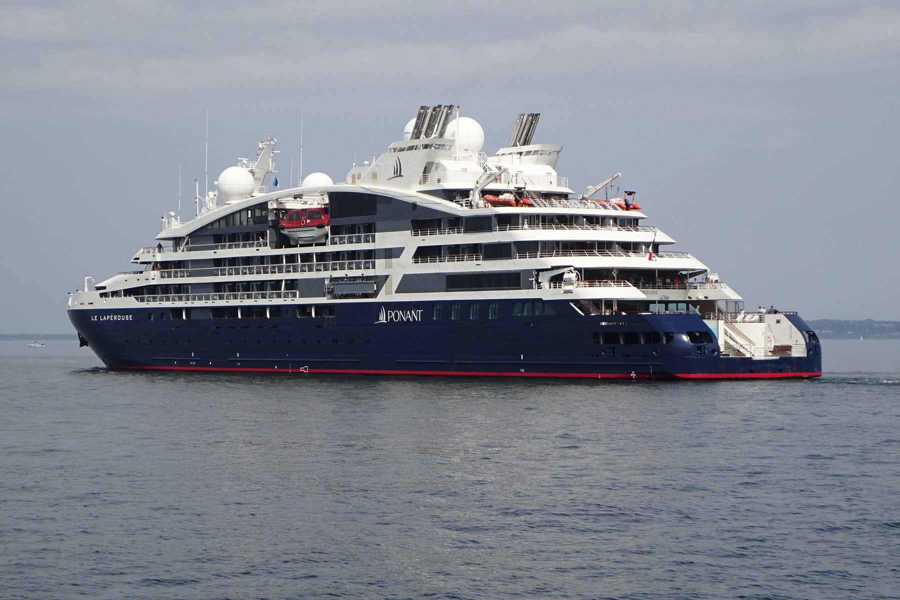 Ponant's Le Lapérouse leaving Tallinn, navy hull and white superstructure