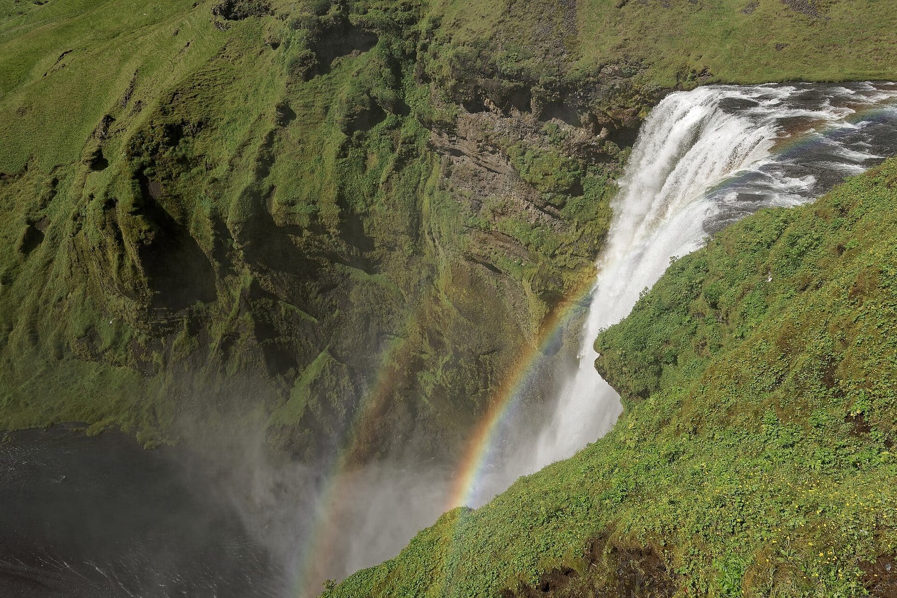Rainbow over Skógafoss waterfall on Iceland's south coast