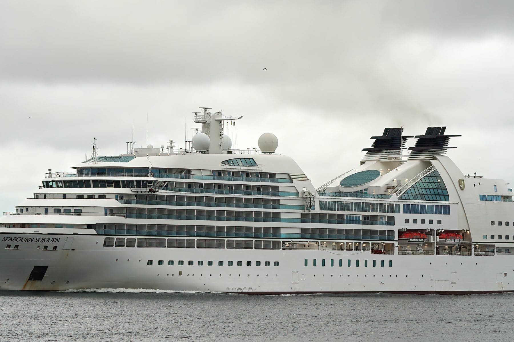 Seabourn Sojourn under way, twin funnels and tiered aft decks
