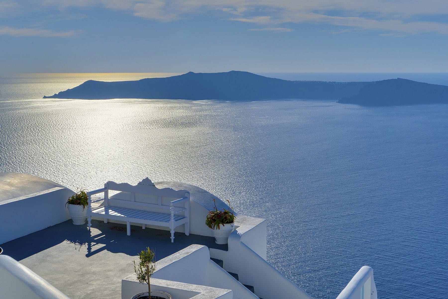 Whitewashed terrace above the caldera at Oia, Santorini, looking across the Aegean