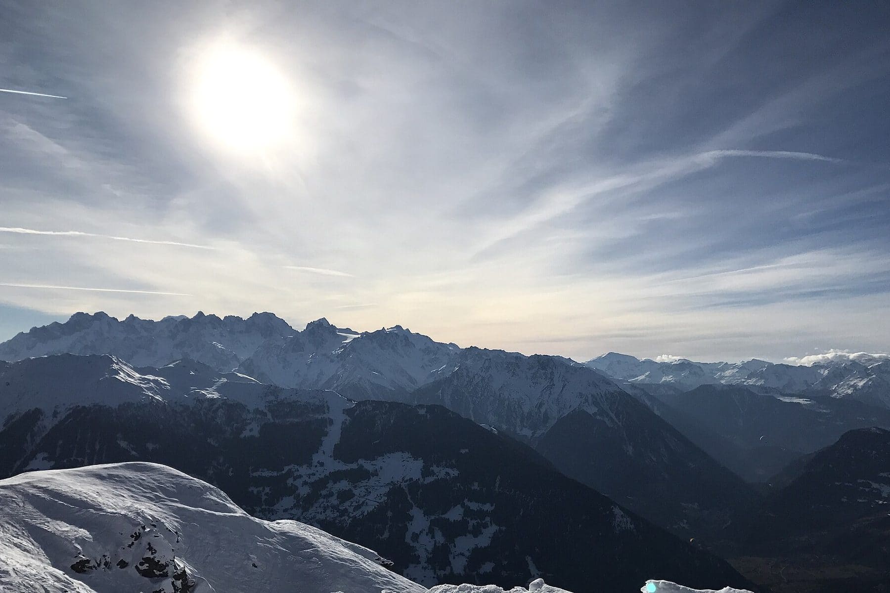 Winter view west across the ski slopes into the Verbier valley