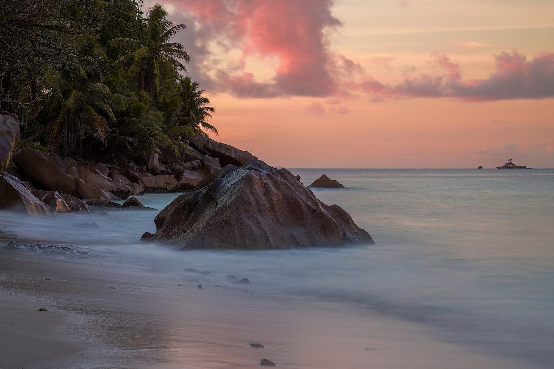 Granite boulders on a La Digue beach at sunset, Seychelles