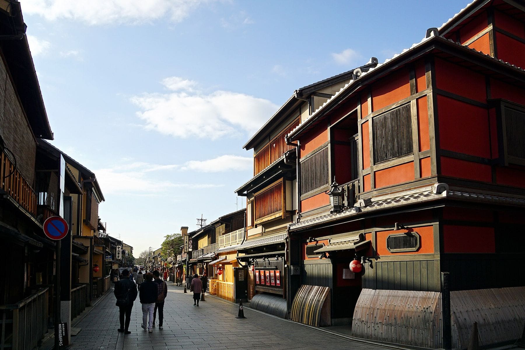 Wooden machiya houses on a quiet street in Kyoto
