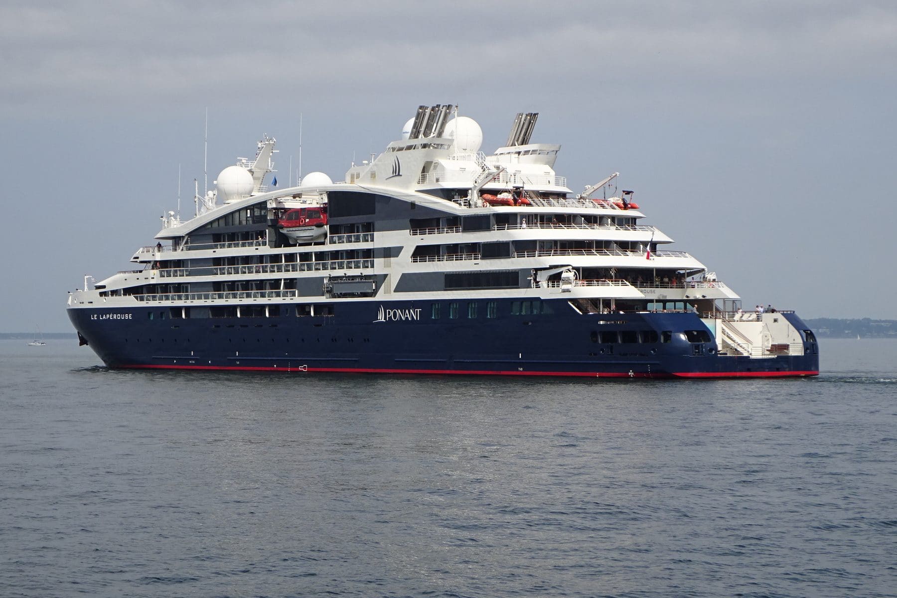 Ponant's Le Lapérouse leaving Tallinn, navy hull and white superstructure