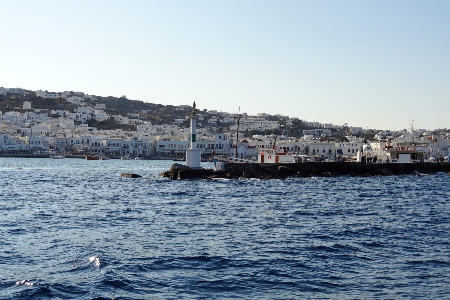 The old harbor of Mykonos town, whitewashed houses along the quay, Greek islands