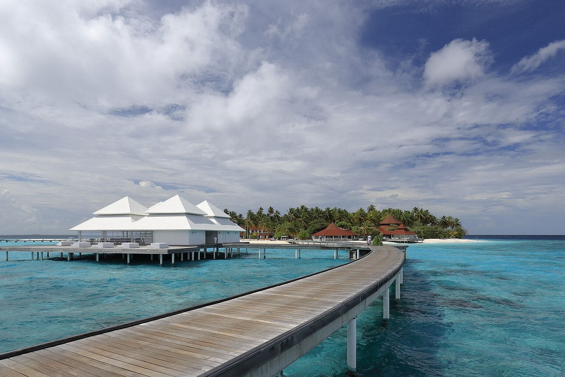 Water villas on a jetty over a Maldivian lagoon