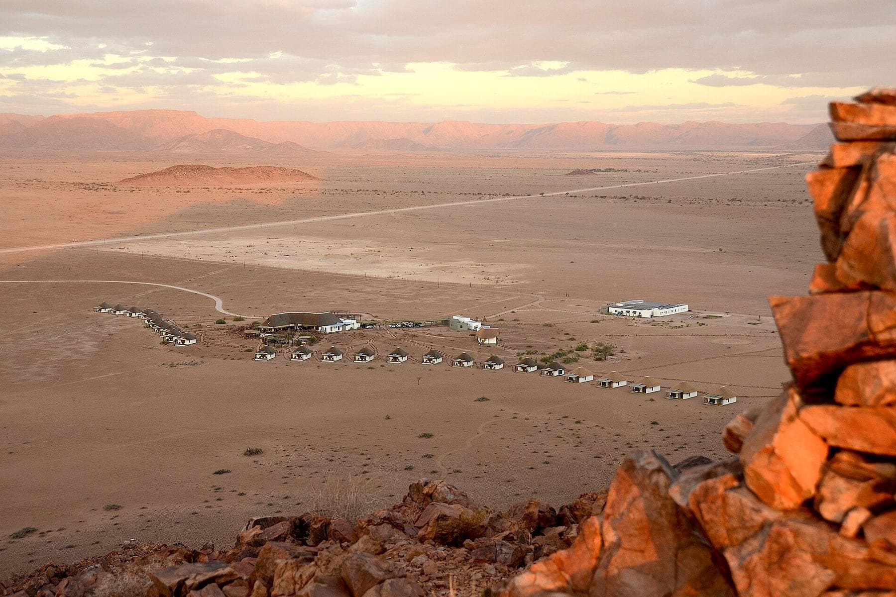 An empty gravel road through the Namib Desert