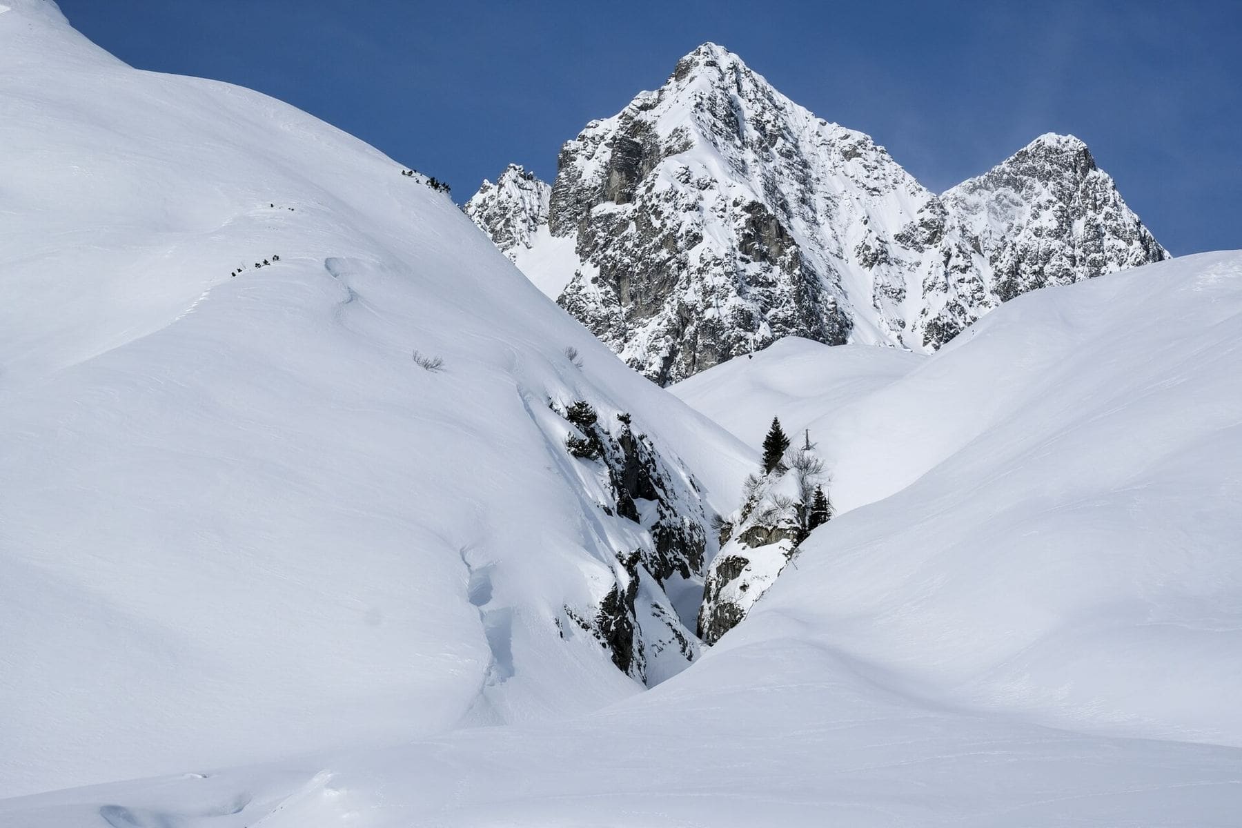 Skiing above the treeline in the Arlberg, Austria