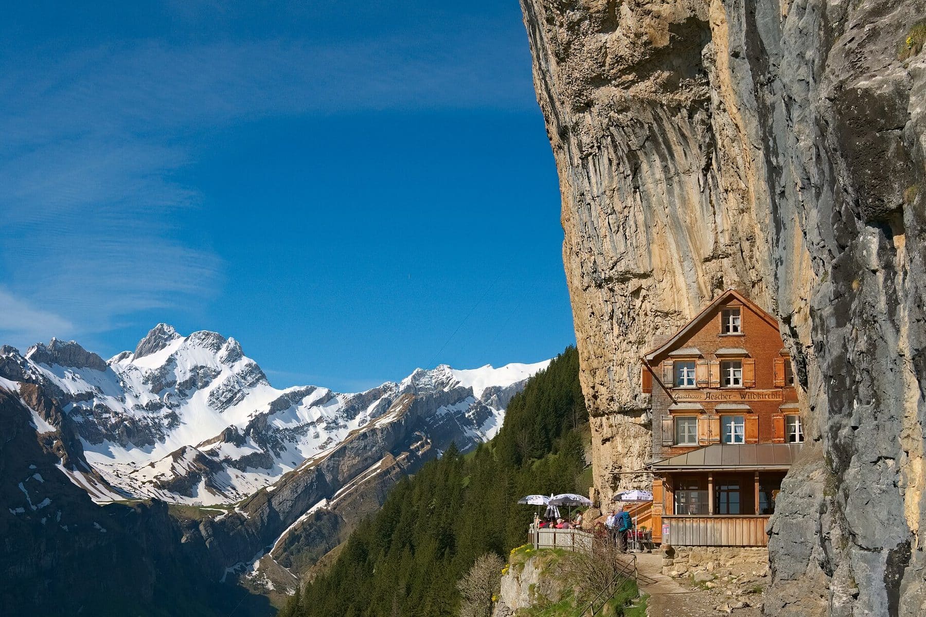 A mountain guesthouse set against the cliffs of the Alpstein, Switzerland