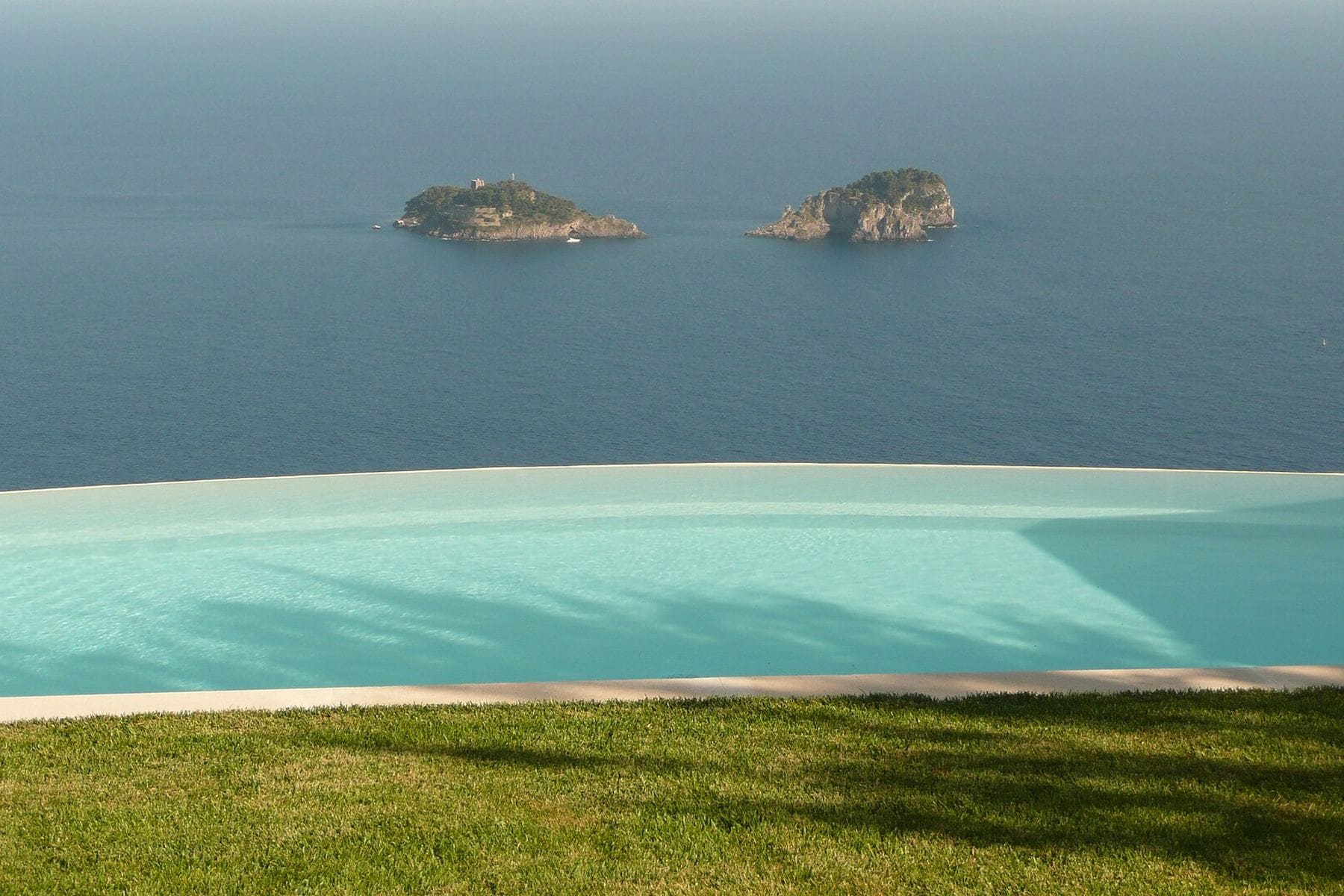 An infinity pool at a private villa above the sea