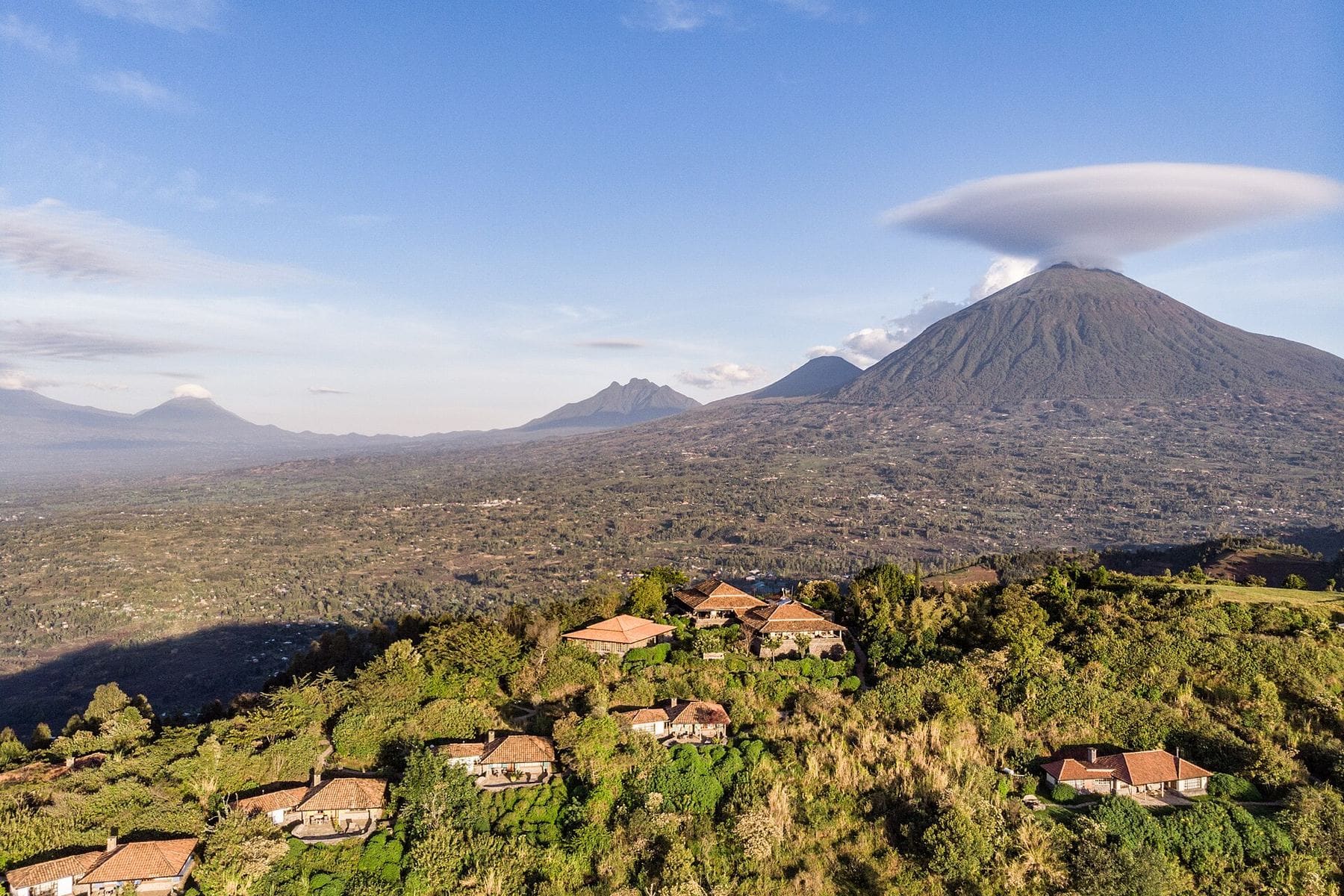 The Virunga volcanoes seen across Rwandan farmland