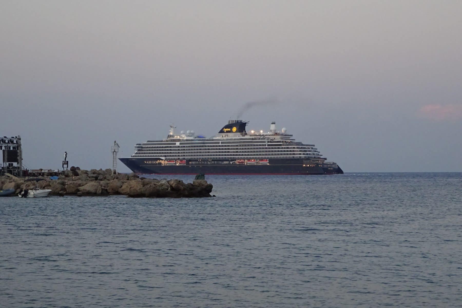 Explora I leaving the port of Rhodes on a clear summer afternoon