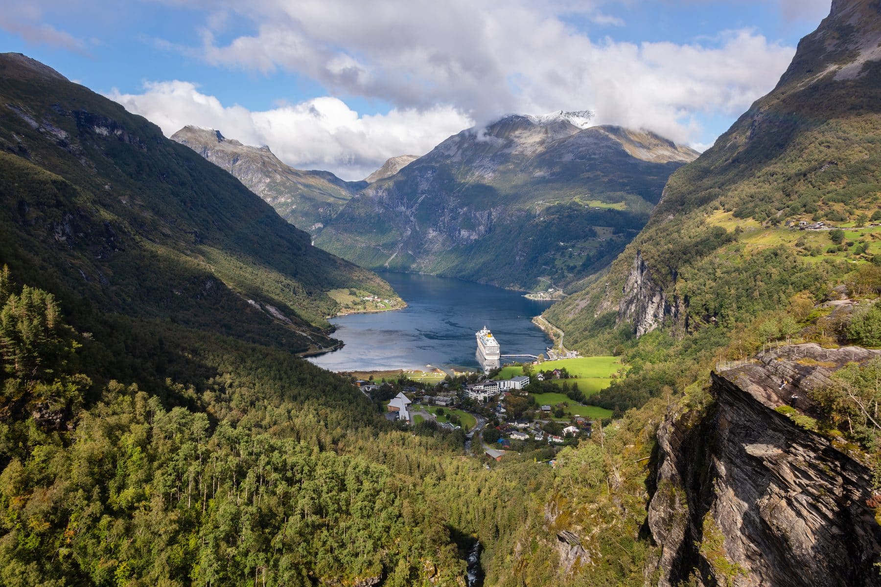 Geirangerfjord from Flydalsjuvet, a cruise ship small against the mountains