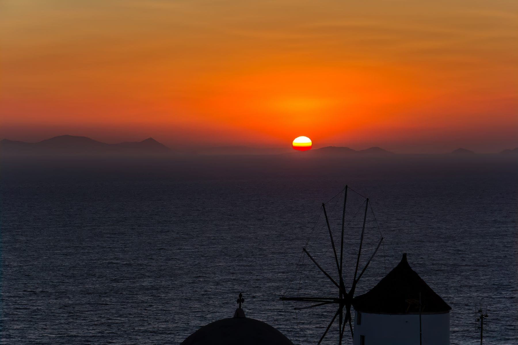 Sunset over the whitewashed houses of Oia, Santorini